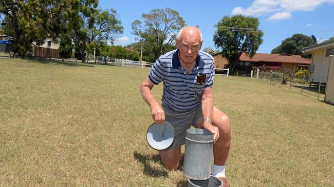 Rex Baguley checks for rain at his Dragon St home in Warwick this year. Picture: Gerard Walsh