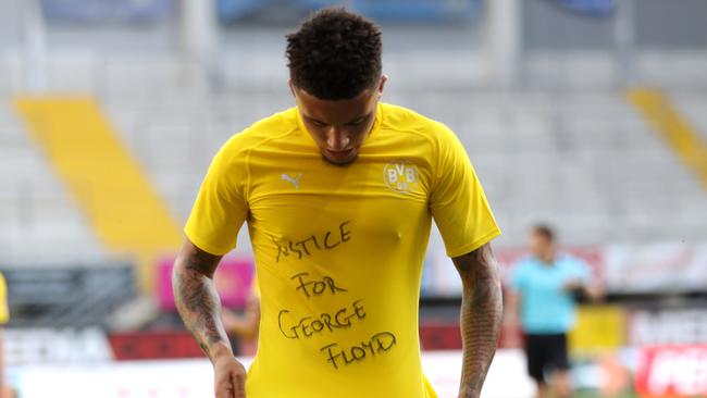 Dortmund midfielder Jadon Sancho shows a "Justice for George Floyd" shirt after scoring a goal at Benteler Arena in Paderborn, Germany