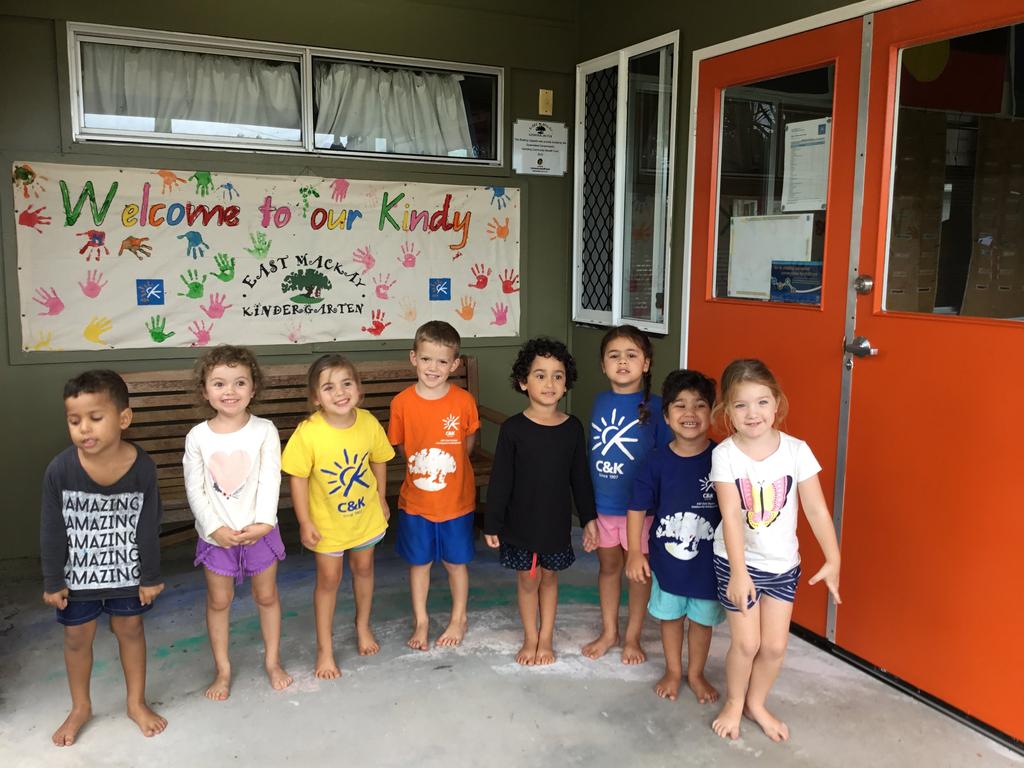 The Kids from C & K East Mackay Community Kindergarten and their newly painted door.