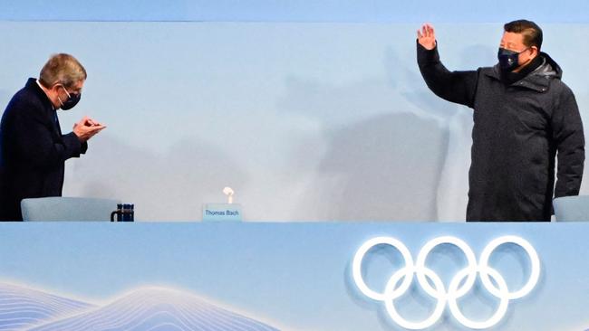 International Olympic Committee (IOC) President Thomas Bach (L) greets China's President Xi Jinping (R) during the opening ceremony of the Beijing 2022 Winter Olympic Games. Picture: AFP