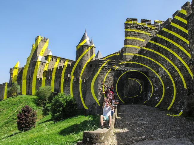 epa06688881 A view of the medieval castle of Carcassonne, southern France, 24 April 2018. Some walls of the castle are painted with yellow concentric circles created by Swiss artist Felice Varini, based in Paris, France, as celebrations of the 20th anniversary of inscription of Carcassonne as UNESCO World Heritage. The artwork will be removed in September 2018. EPA/ARMANDO BABANI