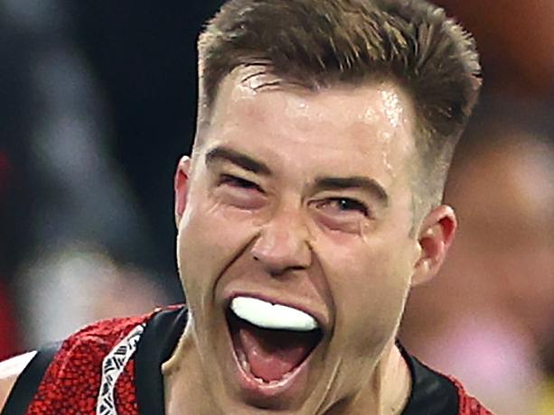 MELBOURNE, AUSTRALIA - MAY 25: Zach Merrett of the Bombers celebrates kicking a goal during the round 11 AFL match between Richmond Tigers and Essendon Bombers at Melbourne Cricket Ground, on May 25, 2024, in Melbourne, Australia. (Photo by Quinn Rooney/Getty Images)