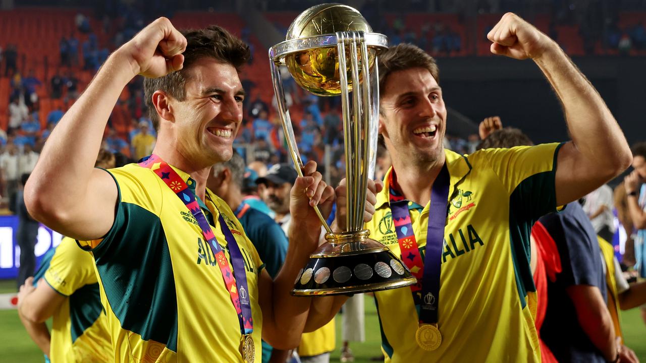 Pat Cummins and Mitchell Marsh of Australia pose with the ICC Men's Cricket World Cup Trophy. Photo by Robert Cianflone/Getty Images