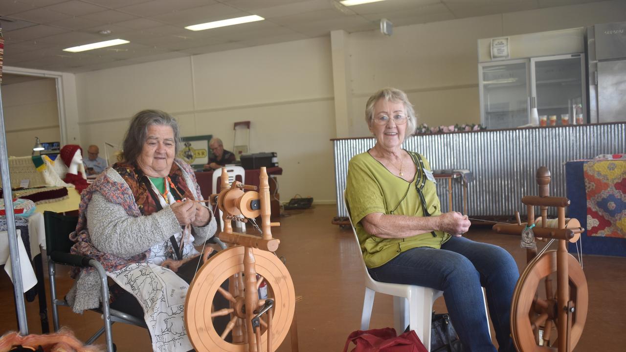 Warwick Spinners and Weavers club members Helen Newton and Judy Donnelly spinning up a storm in the Douglas Feez Pavilion. Picture: Jessica Paul / Warwick Daily News