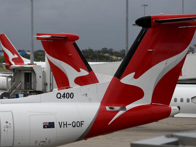 SYDNEY, AUSTRALIA - NCA NewsWire Photos DECEMBER, 31, 2020: The tails of grounded Qantas planes are seen on the tarmac at Sydney Domestic Airport. Victoria has announced a hard border closure with NSW from 11:59pm on January 1, whilst SA will reimpose itÃs hard border closure with NSW from midnight January 1, following 10 new COVID-19 cases in NSW today. Picture: NCA NewsWire/Bianca De Marchi