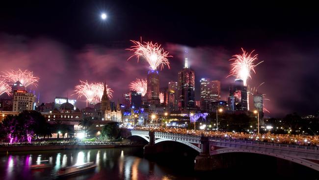 Fireworks light up the sky from building rooftops along the Yarra River during New Year's Eve celebrations in Melbourne last year. Picture: AFP