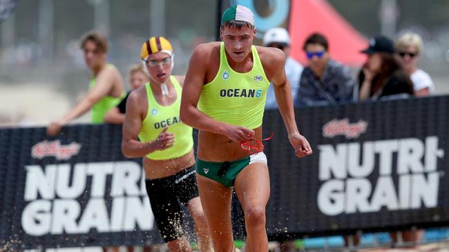 Ky Kinsela, 17, of Currumbin SLSC, wins run-swim-run at Ocean 6 at Queenscliff Beach. Photo: Shane Myers/Ocean6