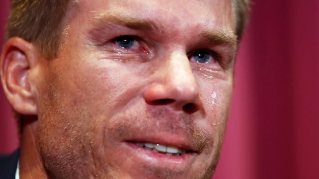 David Warner cries as he talks to the media in Sydney.