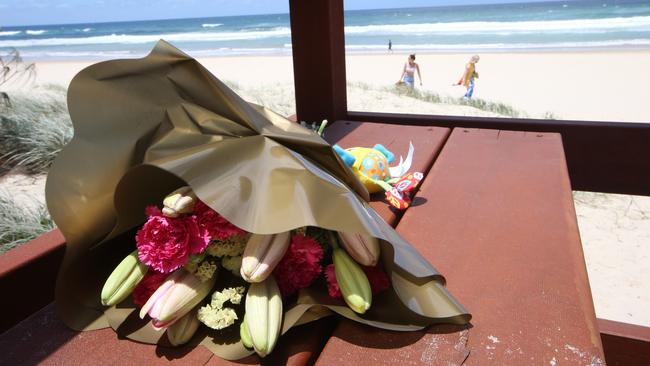 Flowers left near the spot the baby washed up on Surfers Paradise beach. Picture: Glenn Hampson