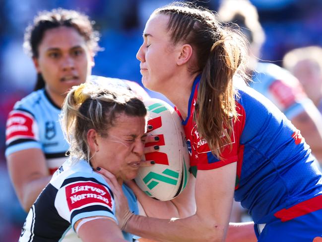 NEWCASTLE, AUSTRALIA - AUGUST 27: Tamika Upton of the Knights is tackled during the round six NRLW match between Newcastle Knights and Cronulla Sharks at McDonald Jones Stadium, on August 27, 2023, in Newcastle, Australia. (Photo by Jenny Evans/Getty Images)