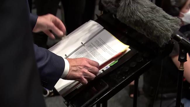 Anthony Albanese thumbs though a folder after faltering when questioned on Labor's NDIS policies during a press conference. Picture: Sky News