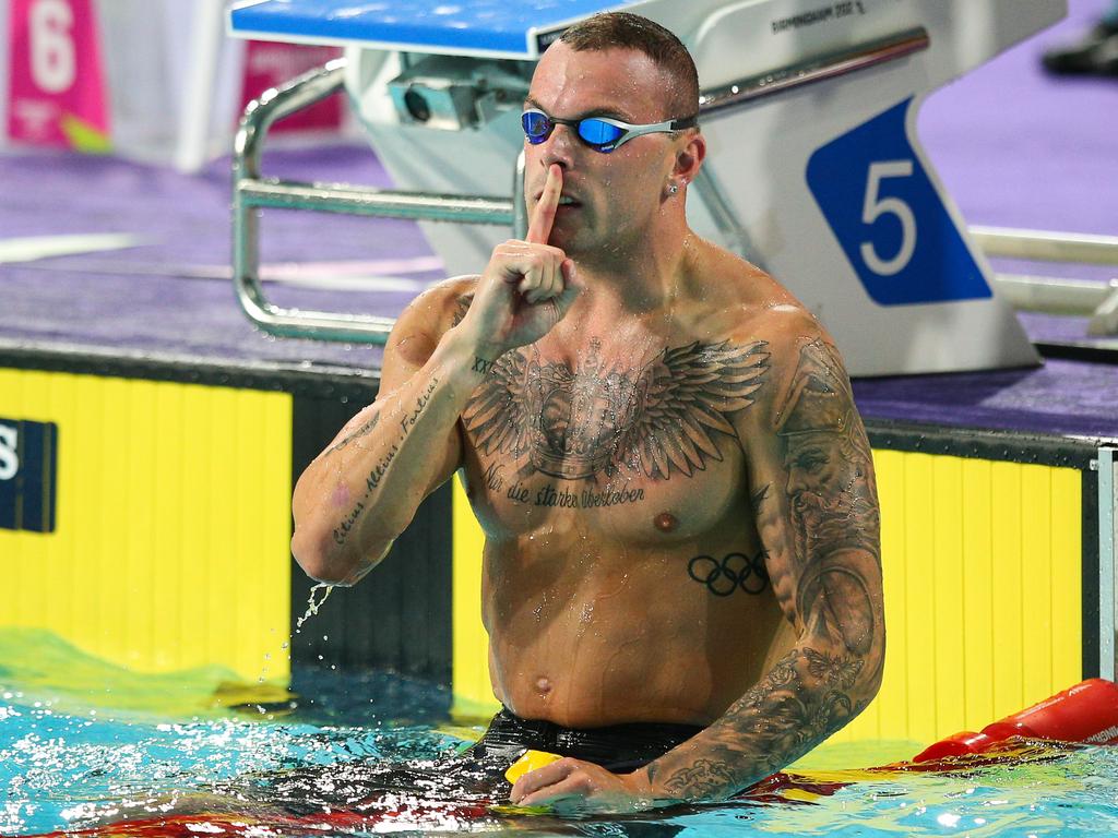 Sick of the media storm, Kyle Chalmers makes a shushing gesture after winning gold in the 100m freestyle at the Commonwealth Games. Picture: Craig Mercer/MB Media/Getty Images