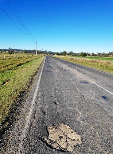 John Bartlett says a stretch of Kyolge Rd, Lismore is so bad it has cost him thousands in car repairs and drivers are risking their lives to avoid the 'monstrous' potholes. Picture: contributed