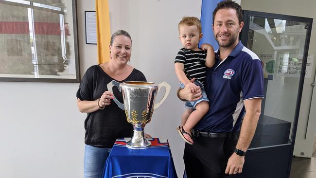 AFL NSW/ACT’s Rebecca McGowan and Marc Geppert with his two-year-old son, Hutch, while the 2019 AFL Premiership Cup was in Wagga. Picture: Toby Vue