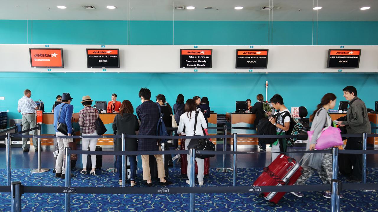 Tourists queuing to check in for their overseas flights at Cairns International Airport. PICTURE: BRENDAN RADKE