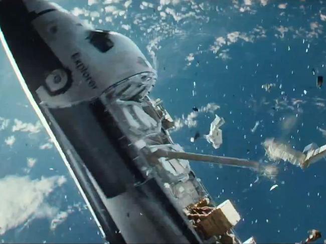 Debris hammer a space shuttle into oblivion in the movie Gravity. Once seen as a frontier of peace, space is now turning into a war zone. Picture: Gravity / Warner Brothers