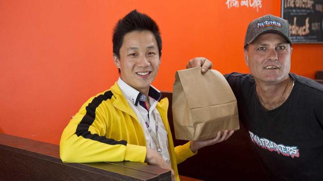 Jiny Yi (left) of Toowoomba startup HappyToo welcomes the support of Phat Burgers and Alan Wynn.