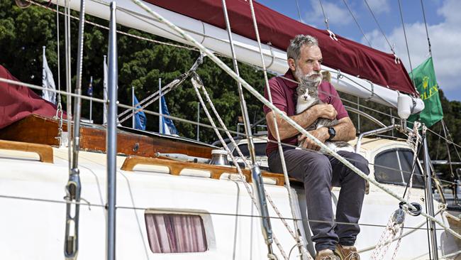 SYDNEY, AUSTRALIA, NOVEMBER 22, 2023. Sylph VI skipper and owner Robert â€˜Bobâ€™ Williams with his cat Oli who will sail with Bob in the Sydney to Hobart yacht race on board Sylph VI. Photographer: Adam Yip