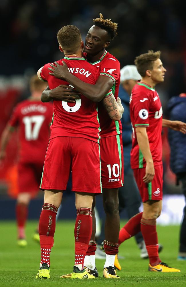 Alfie Mawson of Swansea City and Tammy Abraham.)