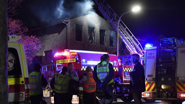 Firefighters at the scene overnight. Picture: Gordon McComiskie