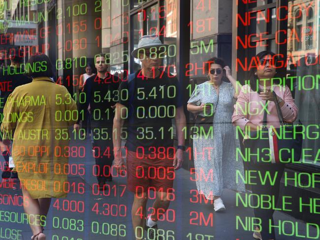 ????SYDNEY, AUSTRALIA : NewsWire Photos - FEBRUARY 24 2025; A general view of people walking past the digital boards of the ASX in the Sydney CBD. Picture: NewsWire/ Gaye Gerard