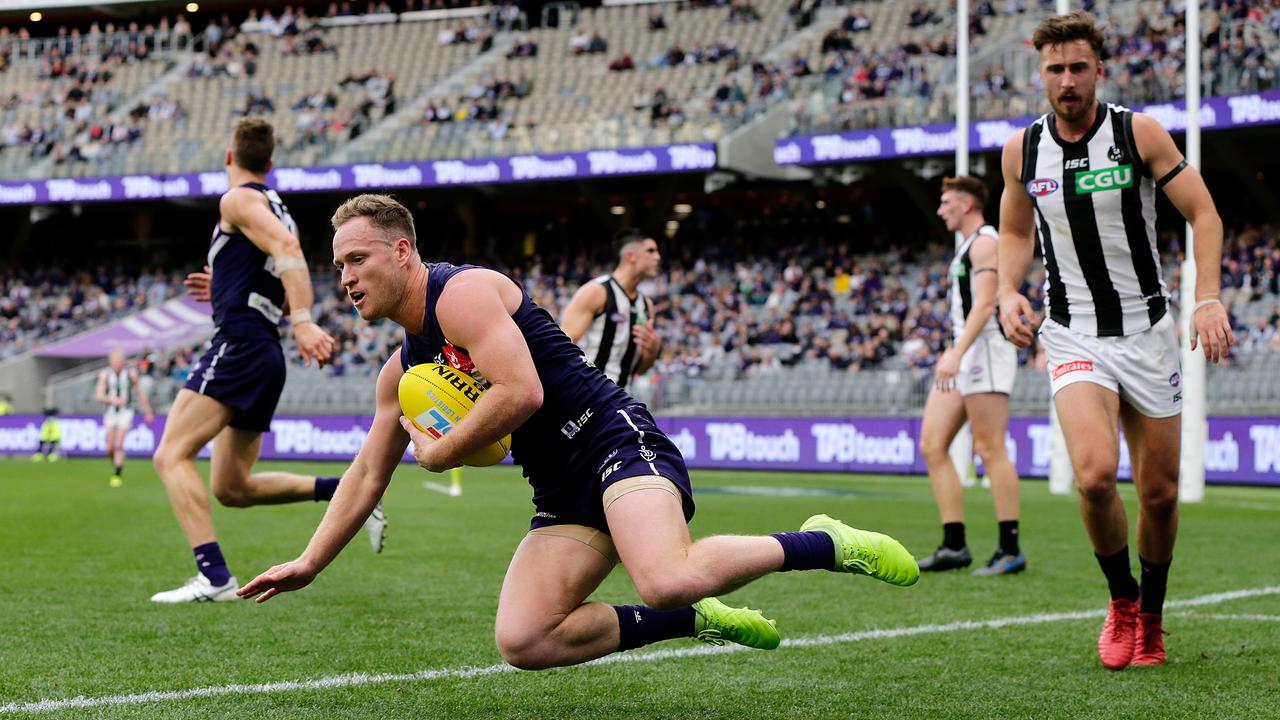 Brandon Matera marks inside the boundary line against Collingwood. Picture: Will Russell/AFL Photos/via Getty Images