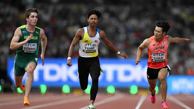 Australia's Rohan Browning crosses the finish line second in the men's 100m heats. Picture: AFP