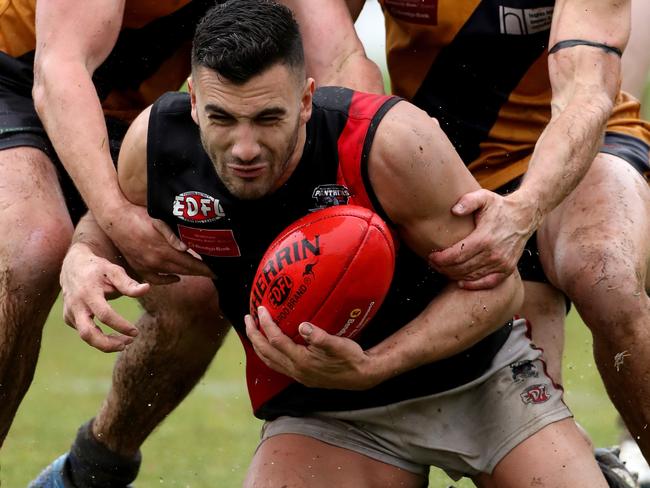 Pascoe Vale’s Dean Soncin is put under pressure against Strathmore. Picture: Mark Dadswell