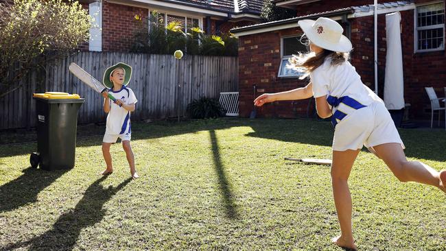 Daniel and Sophie Mitchell get some backyard cricket practice for when lockdown lifts. Picture: Tim Hunter