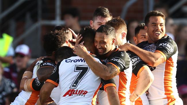 SYDNEY, AUSTRALIA — APRIL 15: Malakai Watene-Zelezniak of the Tigers celebrates with team mates after scoring a try during the round six NRL match between the Manly Sea Eagles and the Wests Tigers at Lottoland on April 15, 2018 in Sydney, Australia. (Photo by Brendon Thorne/Getty Images)