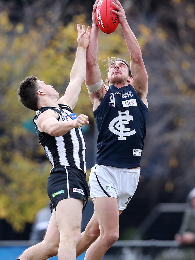 Jesse Palmer reels in a contested mark during Northern Blues victory. Picture: Michael Klein.