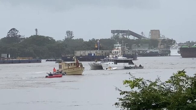 Boats being rescued after being set adrift by loose pontoons in the Brisbane River.