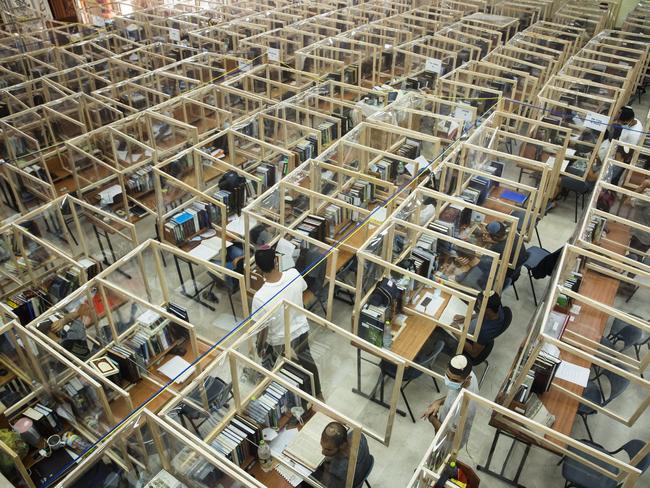 Jewish Seminary students study behind a protective plastic screen cells to prevent the spread of the coronavirus disease COVID-19 in a Hesder Yeshiva in Israel. Picture: Getty