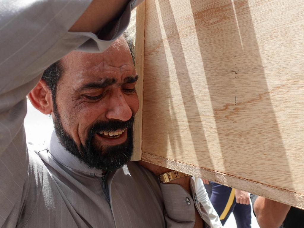 Iraqis mourn relatives killed during a fire at the Ibn Al-Khatib Hospital in Baghdad, a medical facility reserved for the most severe COVID-19 cases. Picture: AFP