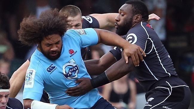 DURBAN, SOUTH AFRICA - MARCH 29: Marcell Coetzee of the Cell C Sharks tackling Jacques Potgieter of the Waratahs during the Super Rugby match between Cell C Sharks and Waratahs at Growthpoint Kings Park on March 29, 2014 in Durban, South Africa. (Photo by Steve Haag/Gallo Images/Getty Images)