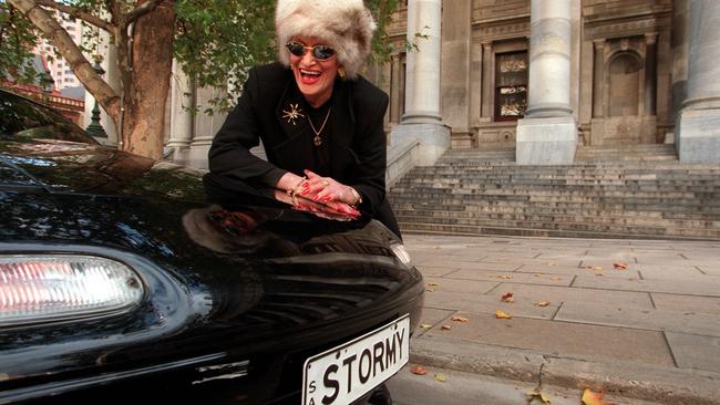 Brothel owner turned political candidate Stormy Summers standing next to her car outside Parliament House in 2000.