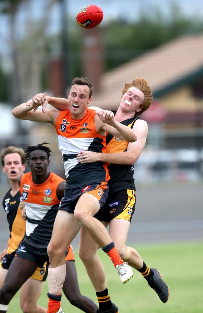 GFL: Geelong West Giants v Grovedale. Geelong West's Jayden Symes and Grovedale's Jason Gniel. Picture: Mike Dugdale