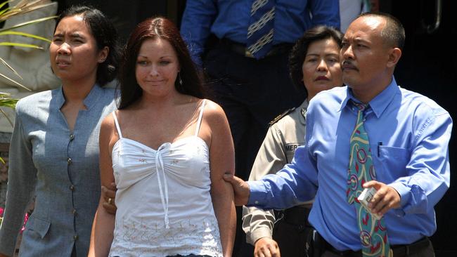 Schapelle Corby is escorted by police to court in Denpasar in October 2004