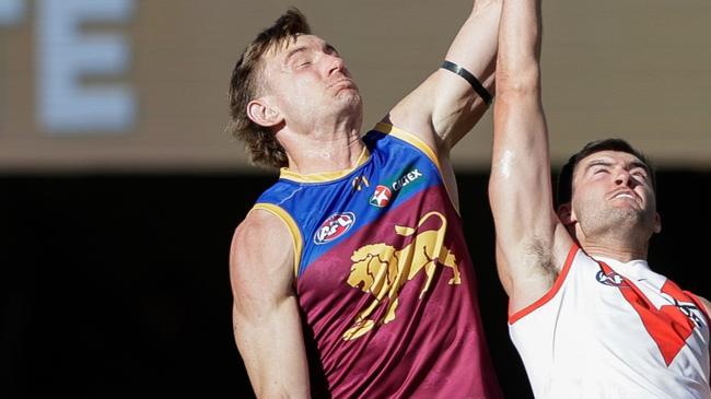 BRISBANE, AUSTRALIA - JULY 21: Harris Andrews of the Lions and Logan McDonald of the Swans compete for the ball during the 2024 AFL Round 19 match between the Brisbane Lions and the Sydney Swans at The Gabba on July 21, 2024 in Brisbane, Australia. (Photo by Russell Freeman/AFL Photos via Getty Images)