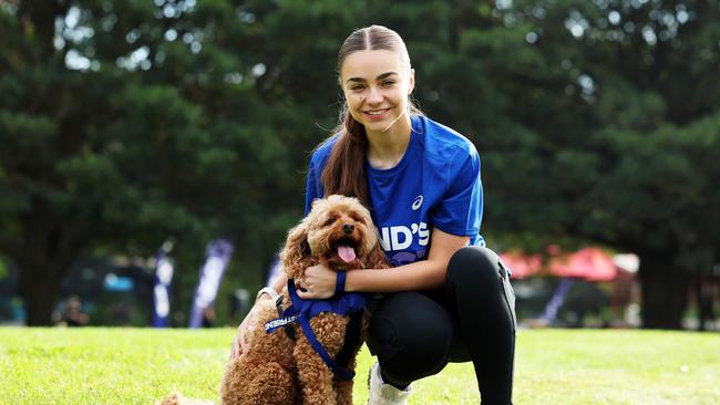 ASICS ambassadors and Western Sydney Wanderers midfielder Amy Chessari with her dog Benson. Picture: Tim Hunter