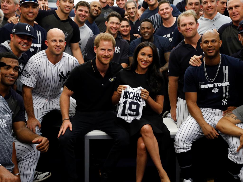 Prince Harry and Meghan Markle pose for a photo with the New York Yankees on June 29, 2019. Picture: WPA Pool/Getty Images.