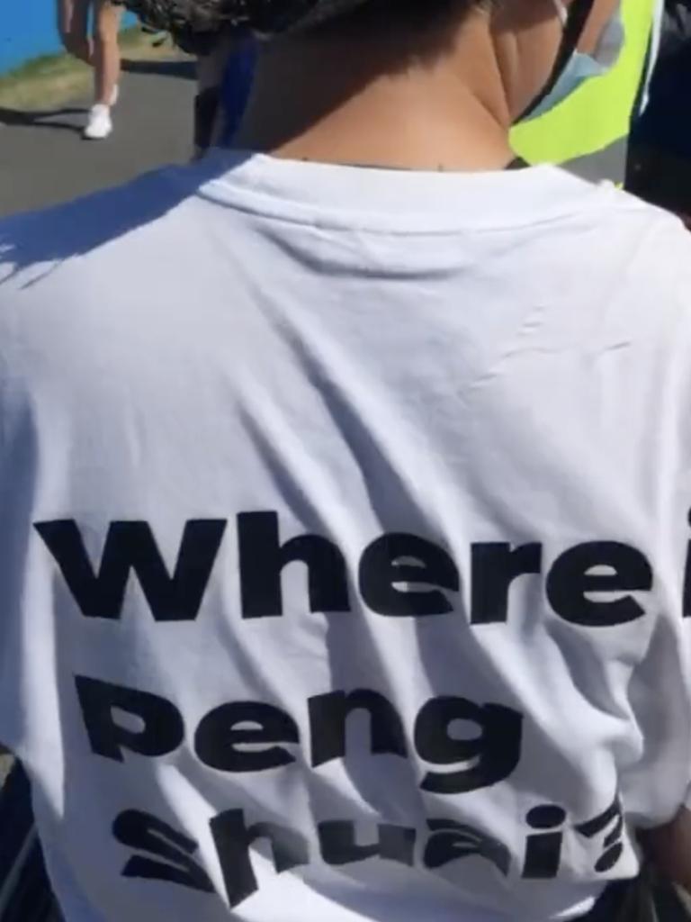 Security ordered this woman to remove a shirt supporting Peng Shuai. Image: Twitter