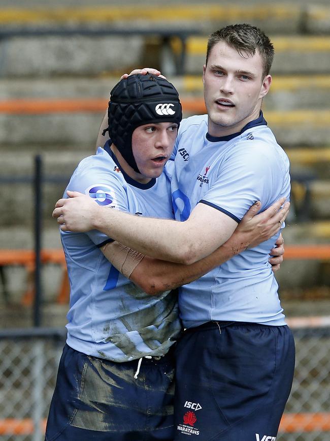 L to R: Waratahs' Brendan Palmer congratulated by Charlie O'Kane