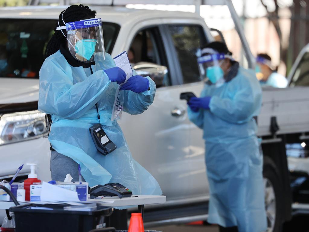 Healthcare workers at the Covid-19 testing site at Fairfield Showground. Picture: NCA NewsWire/David Swift