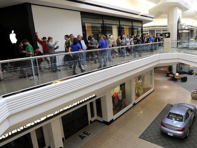 <p>The line for the iPad stretches out into West Farms Mall in Farmington, Connecticut, stretch on April 3, 2010. Picture: AFP / Timothy A. Clary</p>