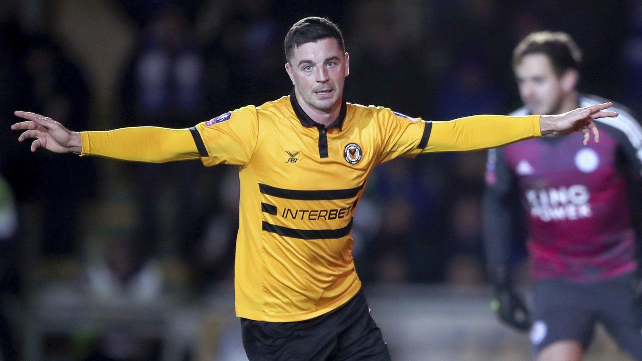 Newport County's Padraig Amond wheels away in celebration after scoring the winner against Leicester City.