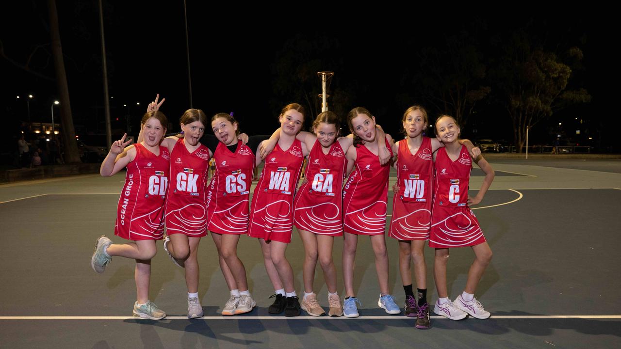 Ocean Grove Warri under-11 netball team pull their funniest faces.