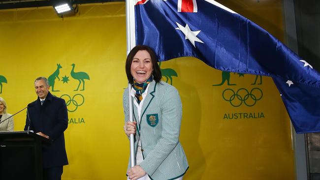 Anna Meares poses with the Australian flag during the Australian Olympic Games flag bearer announcement at Federation Square. Picture: Scott Barbour/Getty Images