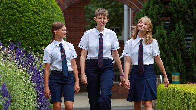 Skye Turner, 13, Nix Pryse Lloyd, 15, and Misha Sedelaar, 15, at Barker College, Hornsby where pants, shorts and skirts are all options on Thursday. Picture: Justin Lloyd