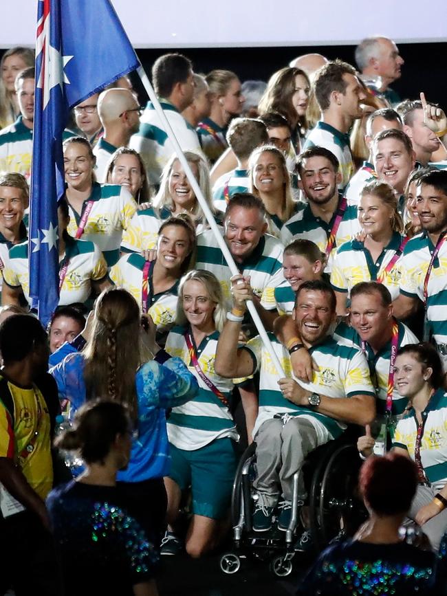 Flag bearer Kurt Fearnley poses for a photograph with teammates during the Closing Ceremony at the Gold Coast 2018 Commonwealth Games on April 15, 2018. Picture: MICHAEL WILLSON